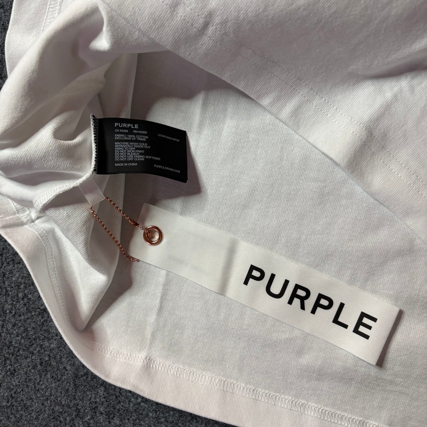 Purple brand script logo white tee