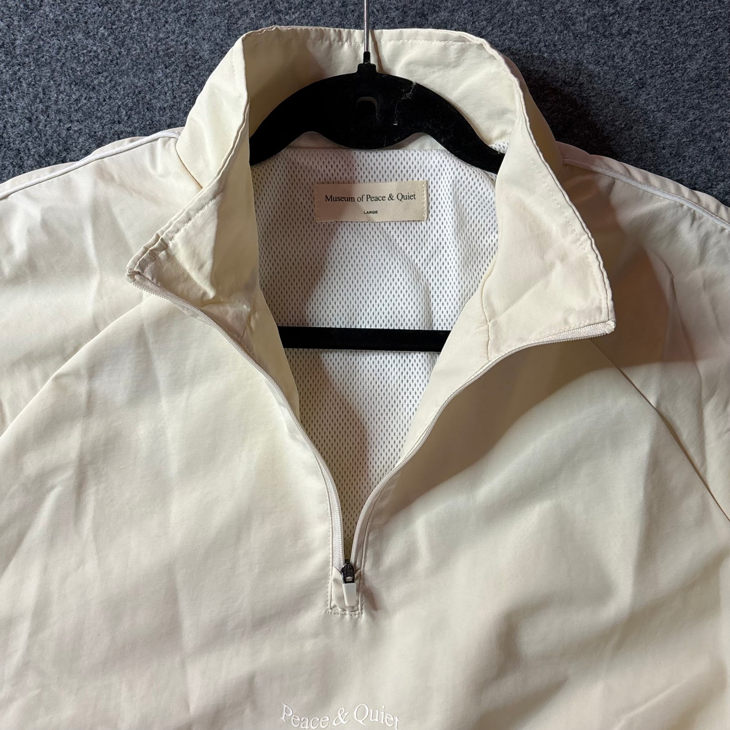 Museum of peace and quiet Wordmark Nylon Quarter Zip
Bone