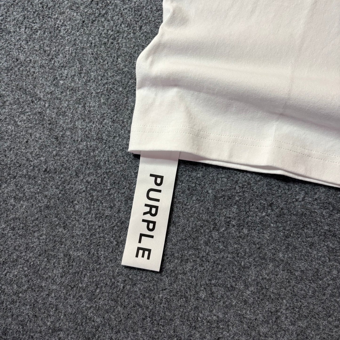 Purple brand script logo white tee