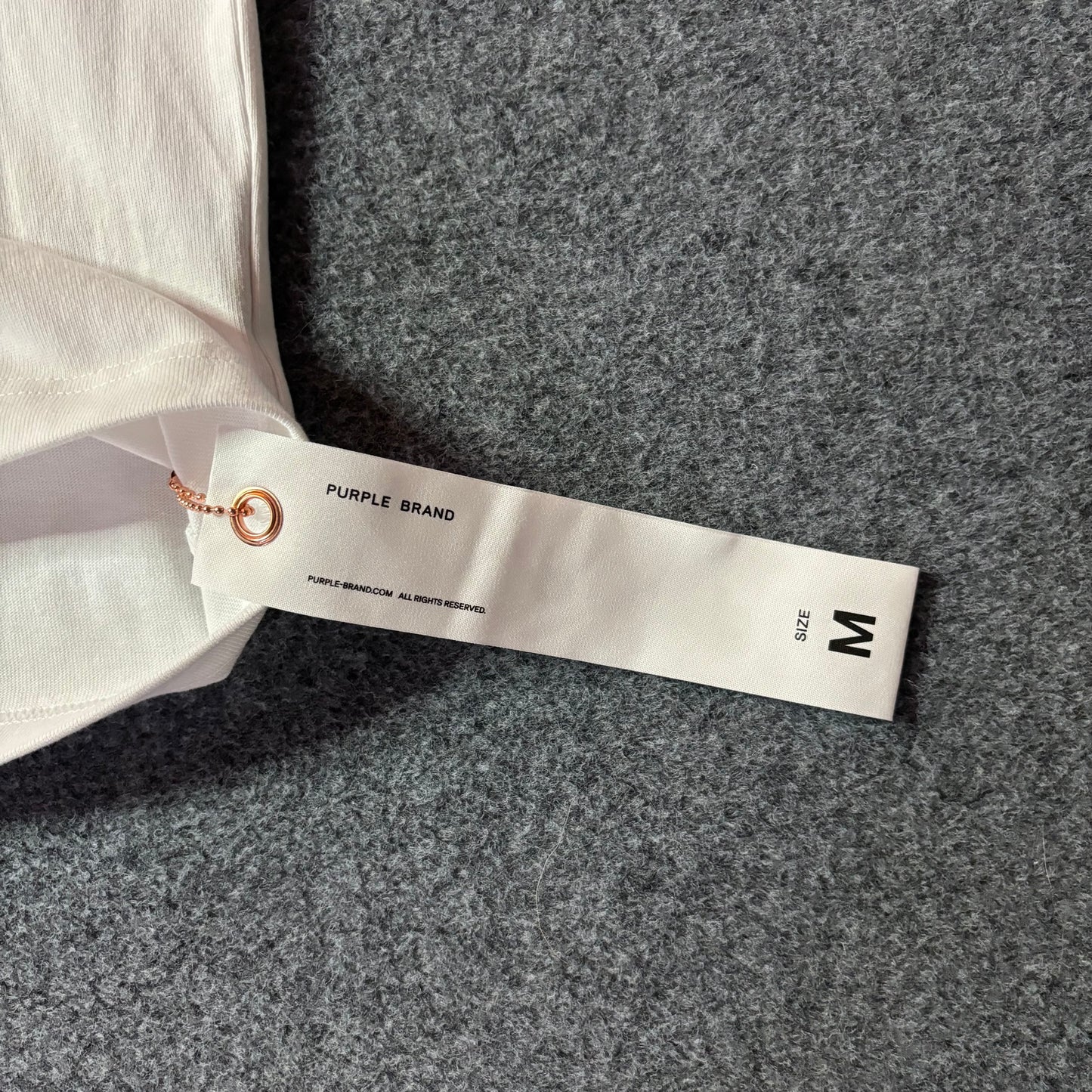 Purple brand script logo white tee