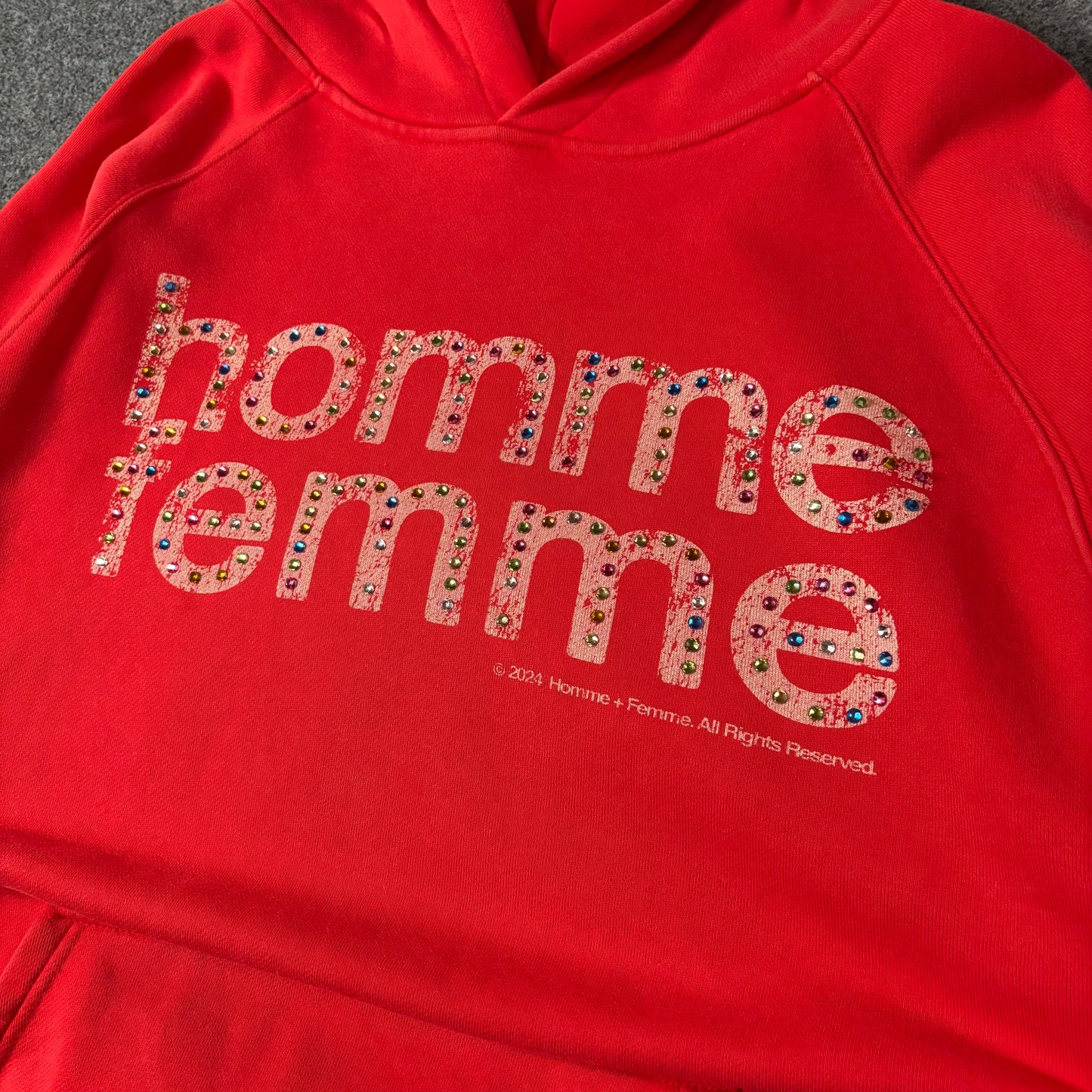Homme Femme Mardi Gras’s red hoodie