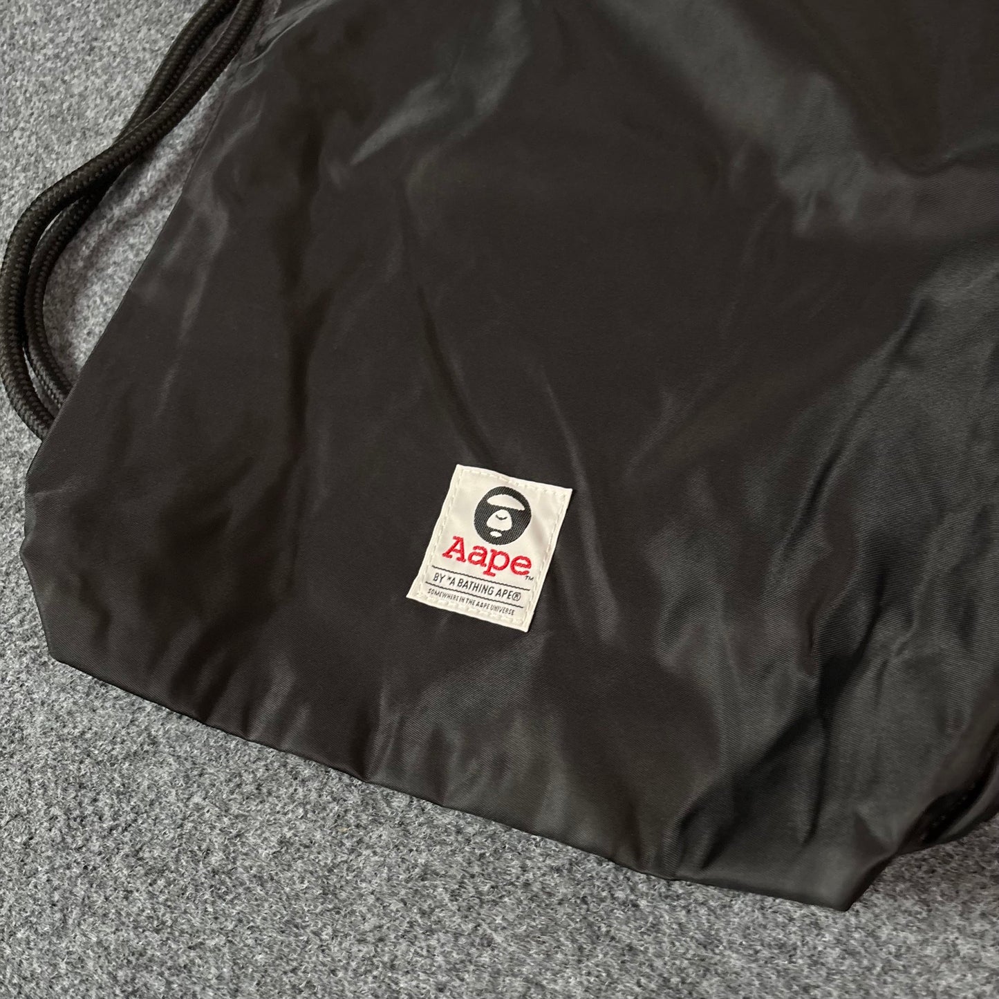 Aape drawstrings bag black