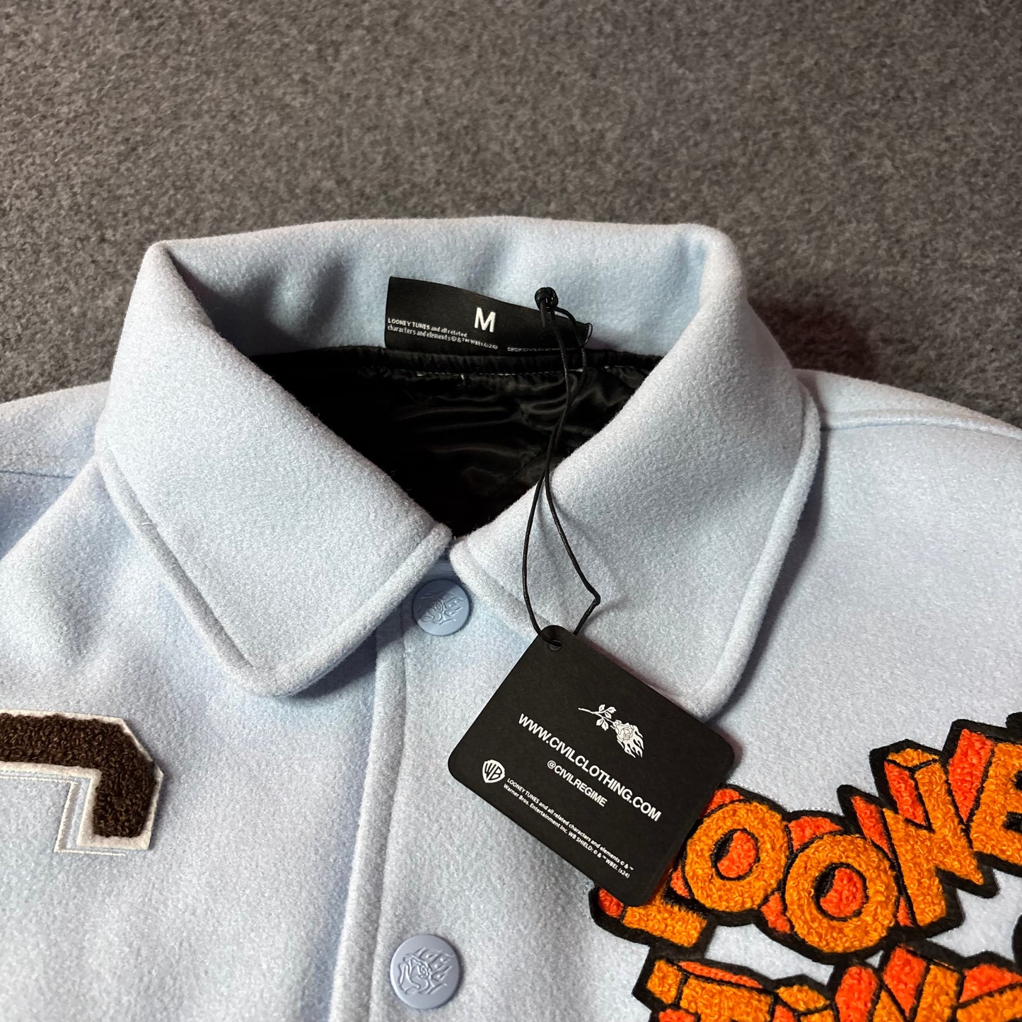 Civil Regime x Looney tunes varsity jacket light blue