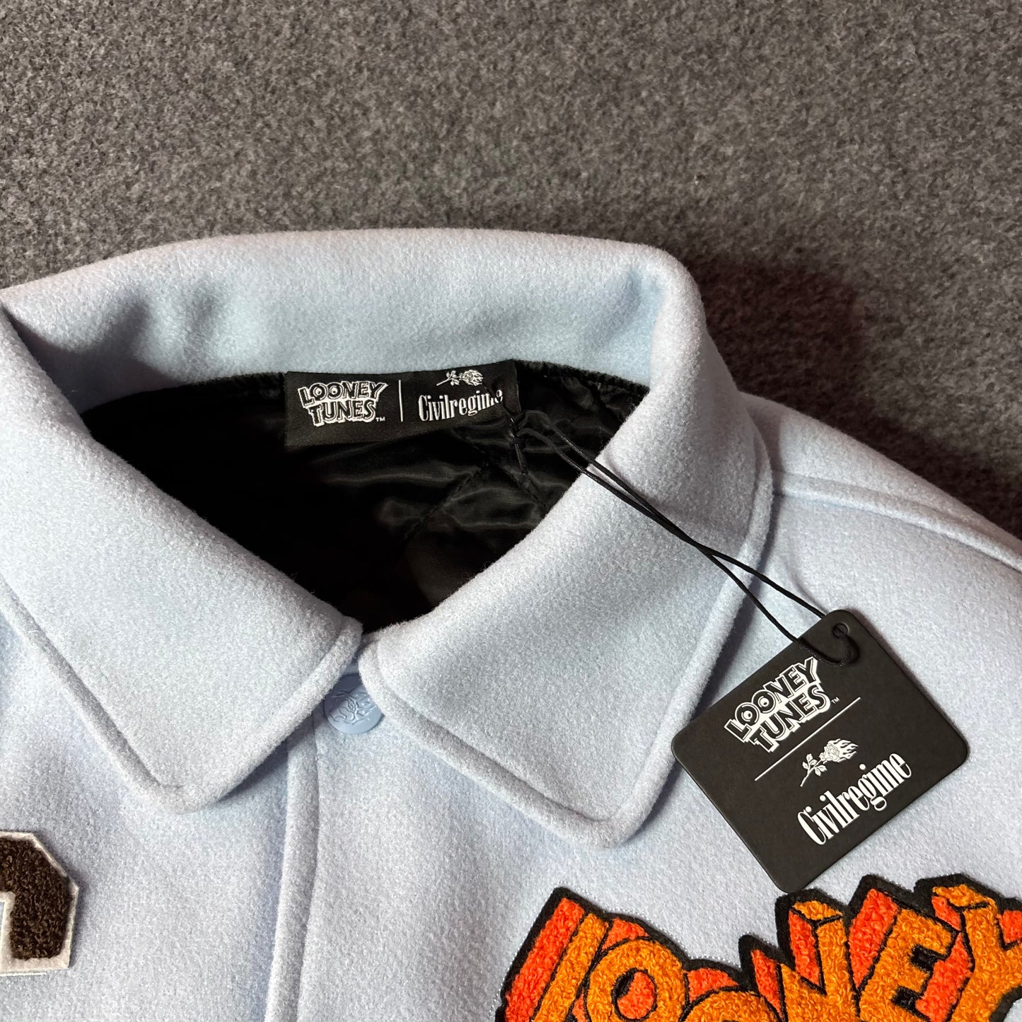 Civil Regime x Looney tunes varsity jacket light blue