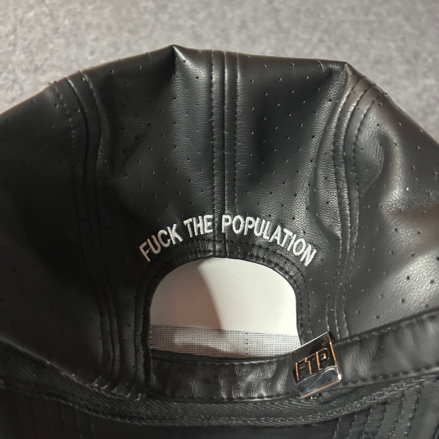 Fuck The Population perforated leather hat