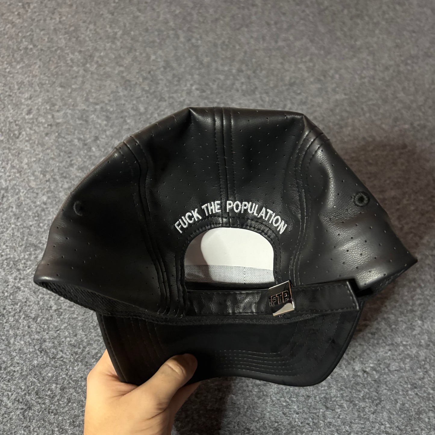 Fuck The Population perforated leather hat