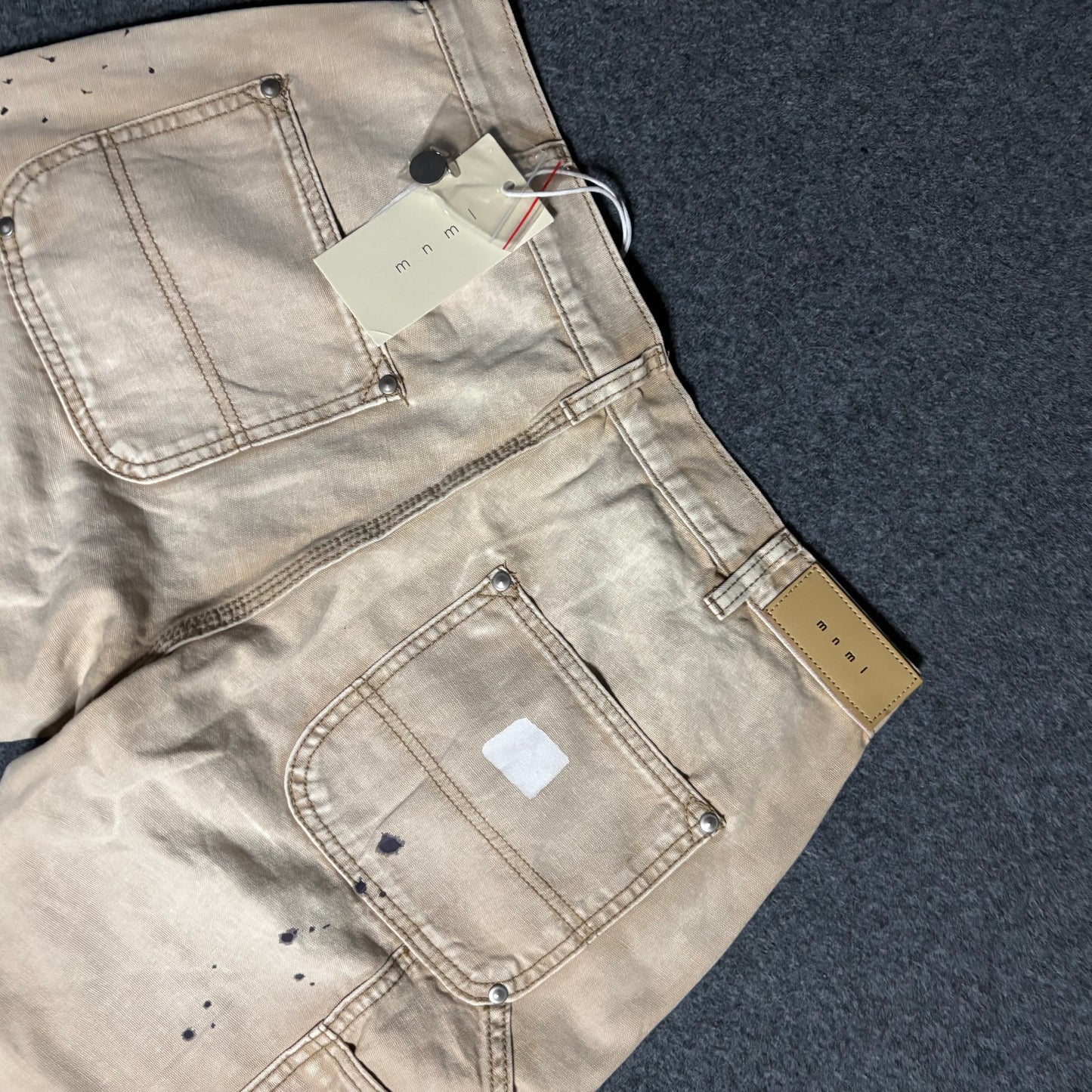 Mnml double knee flared paint splattered pants