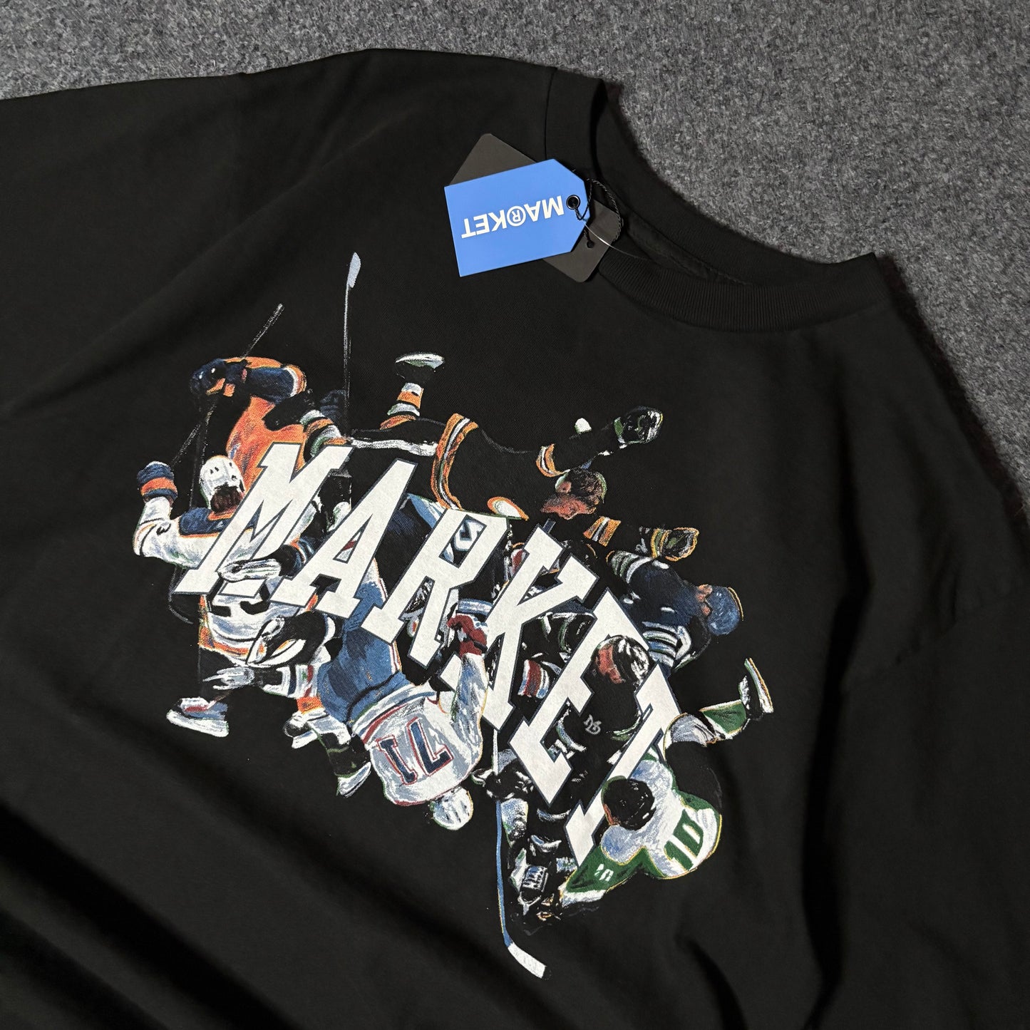 Market Studios hockey logo tee
